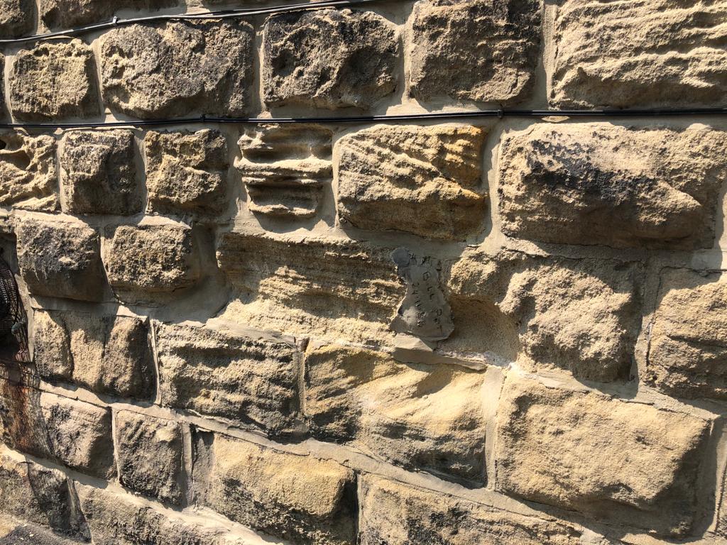 cement pointing covering lime mortar, damage to stone masonry,