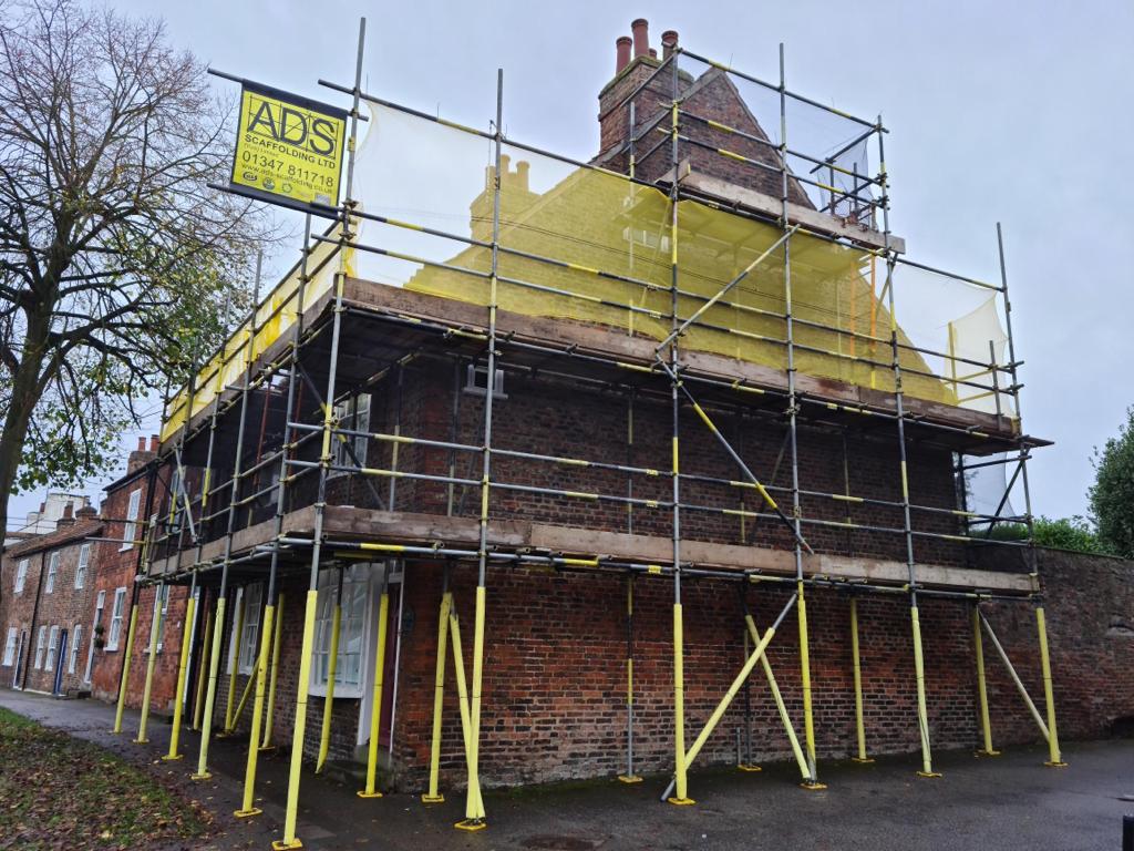 Hot lime pointing and traditional masonry repairs at Dick Turpins House 30-32 York Road a grade two listed building in Fulford,York