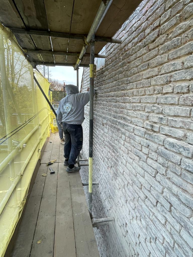 Removing cement mortar from Dick Turpins House in Fulford York