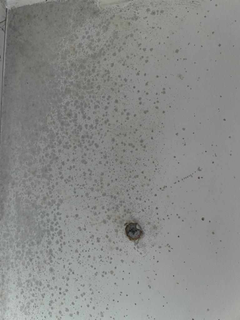 Damp conditions and condensation creating mould spores to form on a non-permeable painted surface in Pontefract