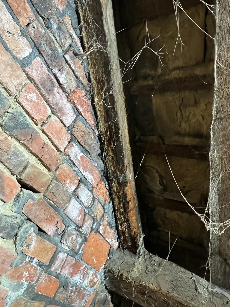 Rotting roof rafter at Westgate Unitarian Chapel caused by water ingress around the chimney stack.